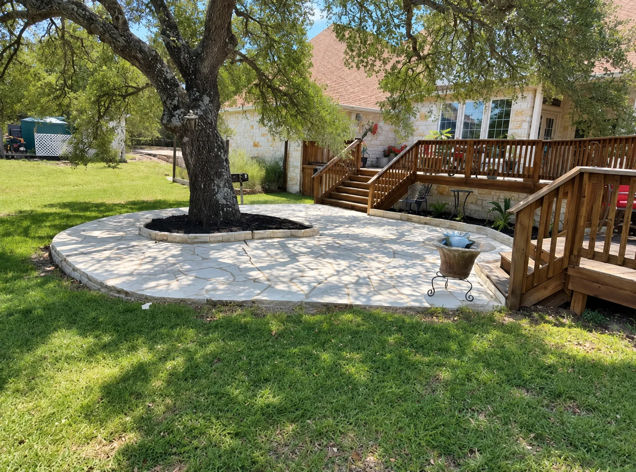 Stone patio beside a landscaped garden